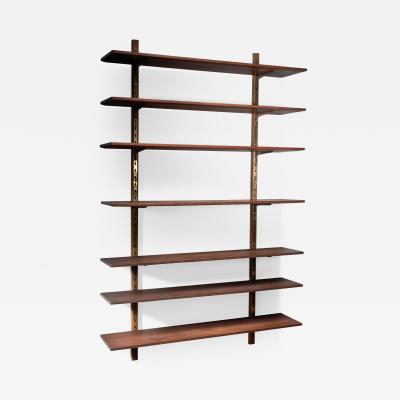 Large shelving unit with brass brackets