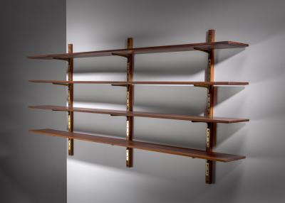 Large shelving unit with brass brackets