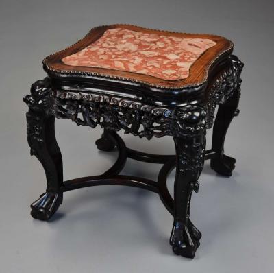 Late 19th century Chinese hardwood pot stand with shaped marble inset top