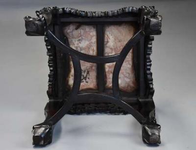 Late 19th century Chinese hardwood pot stand with shaped marble inset top