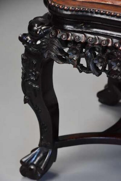 Late 19th century Chinese hardwood pot stand with shaped marble inset top