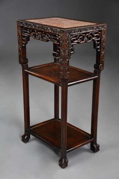 Late 19thc matched pair of freestanding Chinese hardwood pot stands