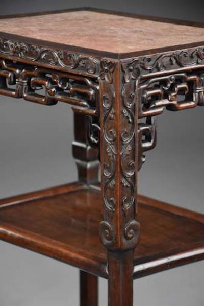 Late 19thc matched pair of freestanding Chinese hardwood pot stands