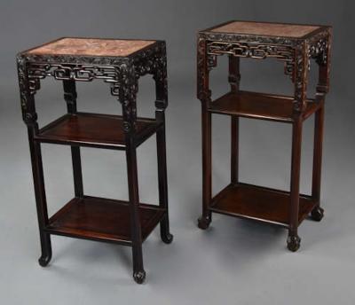 Late 19thc matched pair of freestanding Chinese hardwood pot stands