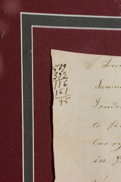 Letter Fragment and Antique Coins in Burgundy Matting and a Gilt Frame