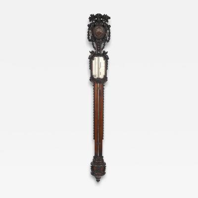 Lord Vernon s Sudbury Hall lime wood barometer by J Braund after Grinling