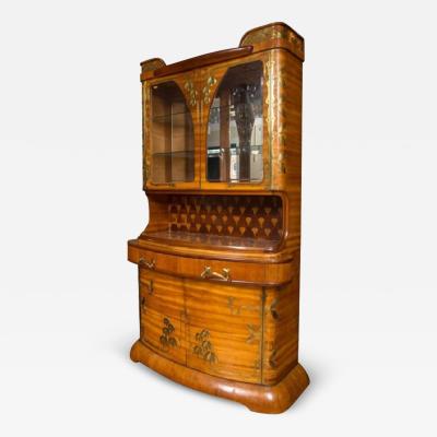 Louis Majorelle AN ART NOUVEAU LOUIS MAJORELLE BRASS MOUNTED FRUITWOOD CABINET