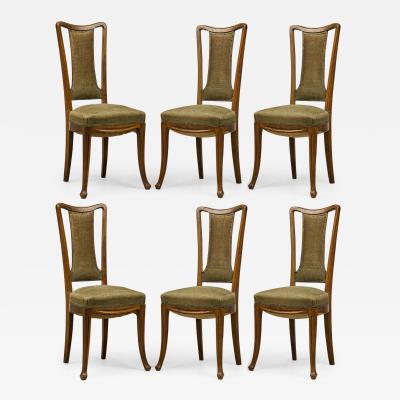 Louis Majorelle Set of 8 Louis Majorelle Carved Walnut and Sage Green Muslin Side Chairs