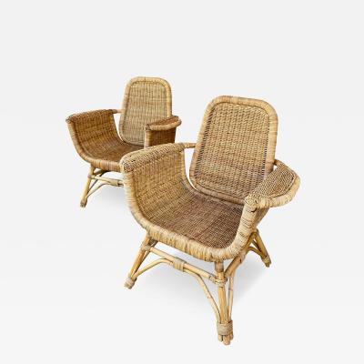Louis Sognot Louis Sognot refined pair of rattan arm chairs in good vintage condition