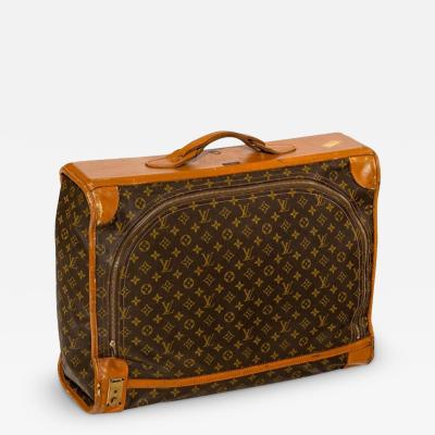 1950s Louis Vuitton suitcase, with leather strap work and canvas