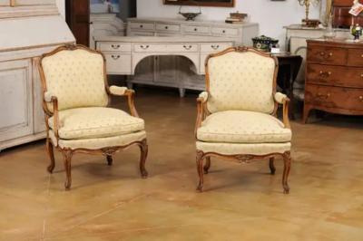Louis XV Style French Walnut Fauteuils la Reine with Carved Floral Motifs