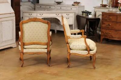 Louis XV Style French Walnut Fauteuils la Reine with Carved Floral Motifs