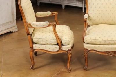 Louis XV Style French Walnut Fauteuils la Reine with Carved Floral Motifs