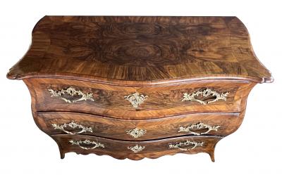 Louis XV three drawer black walnut bombe form chest