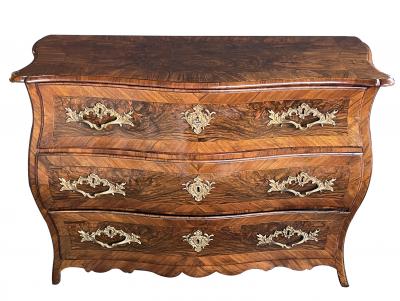 Louis XV three drawer black walnut bombe form chest