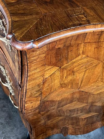 Louis XV three drawer black walnut bombe form chest