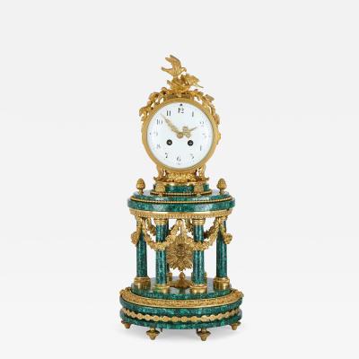 Louis XVI style ormolu mounted malachite column mantel clock