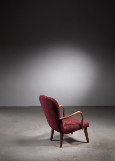 Lounge chair with curved armrests and red upholstery Denmark 1940s