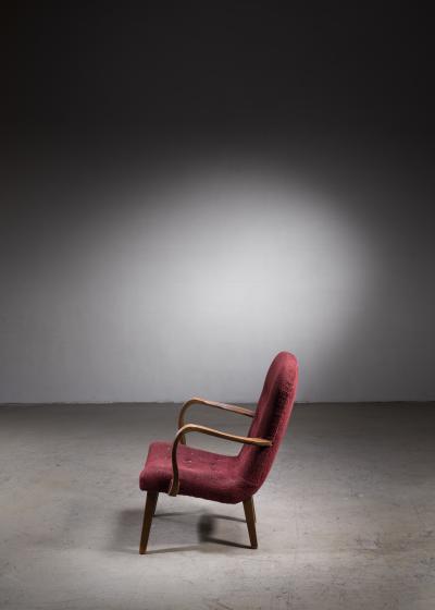 Lounge chair with curved armrests and red upholstery Denmark 1940s