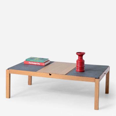 Low table with wooden and slate top one compartment under the central