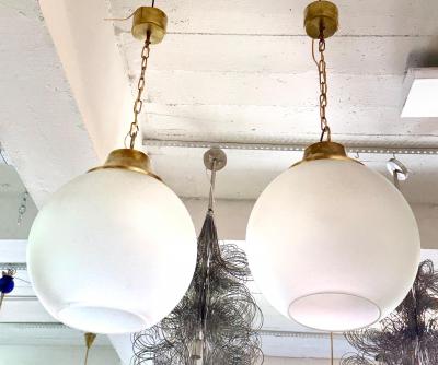Luigi Caccia Dominioni Pair of Italian Midcentury Brass Satin Glass Ball Pendants by Caccia Dominioni