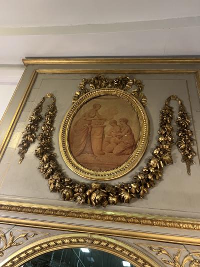 MAGNIFICIENT MONUMENTAL CARVED GILT CREAM TRUMEAU MIRROR WITH OVAL PAINTING