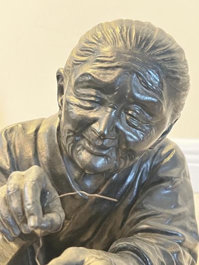 MEIJI PERIOD JAPANESE BRONZE OF ELDER WOMAN SEWING