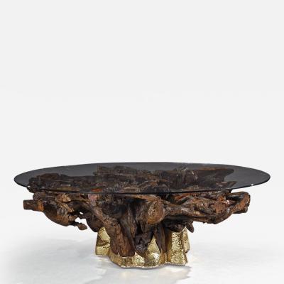 MID 20TH CENTURY BRASS MOUNTED ROOT COFFEE TABLE WITH OVAL GLASS TOP