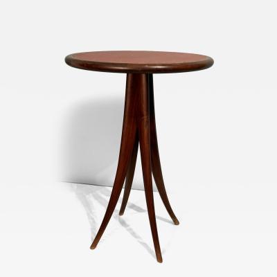 MID CENTURY ITALIAN LEATHER TOP AND SPLAYED WOOD TABLE
