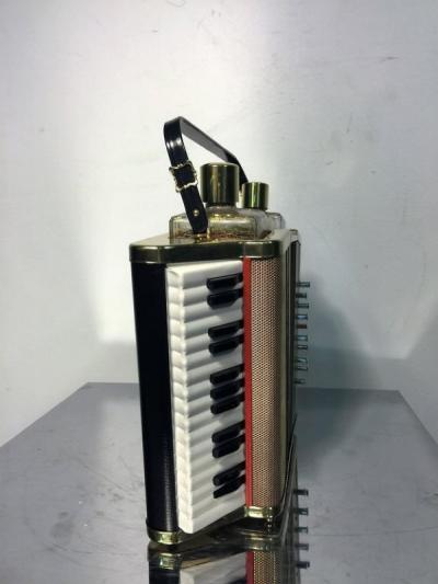 MID CENTURY MUSICAL ACCORDIAN BAR SET