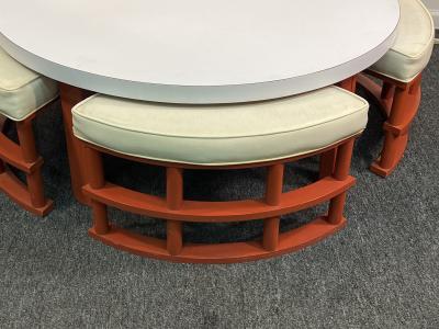 MID CENTURY ORANGE RATTAN STOOLS AND LAMINATE COFFEE TABLE