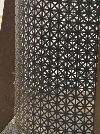 MID CENTURY PERFORATED METAL AND WOOD THREE LEGGED TRASH CANNISTER