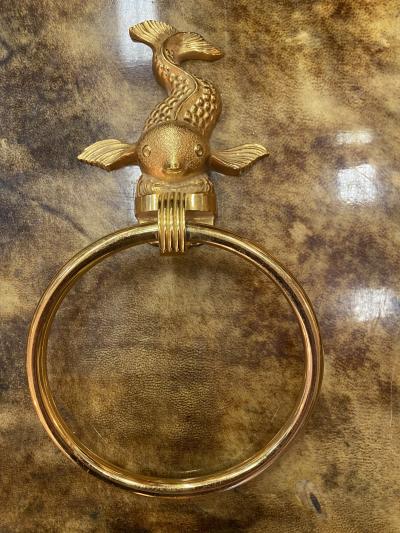 MID CENTURY TRIO OF GOLD PLATED BRASS DOLPHINS AND MERMAID TOWEL RINGS