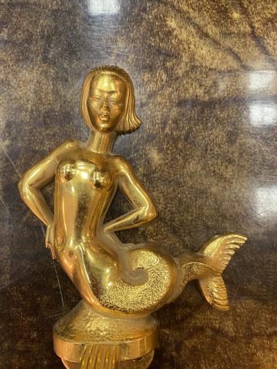 MID CENTURY TRIO OF GOLD PLATED BRASS DOLPHINS AND MERMAID TOWEL RINGS