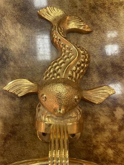 MID CENTURY TRIO OF GOLD PLATED BRASS DOLPHINS AND MERMAID TOWEL RINGS