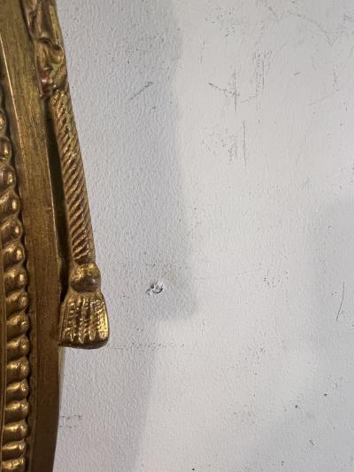 MODERN ANTIQUE REPRODUCTION OF GILT WOOD AND GESSO FEDERAL OVAL MIRROR