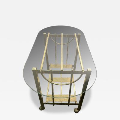 MODERN GOLDTONE TUBULAR METAL WITH GLASS OBLONG TOP BAR CART
