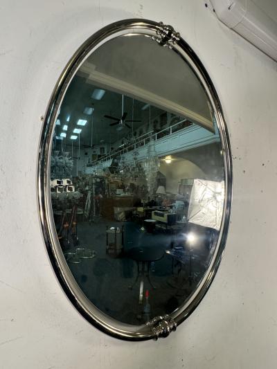 MODERN PAIR OF FLOATING OVAL CHROME FRAMED MIRRORS