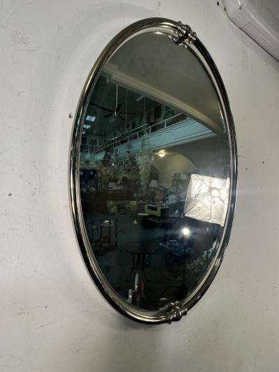 MODERN PAIR OF FLOATING OVAL CHROME FRAMED MIRRORS