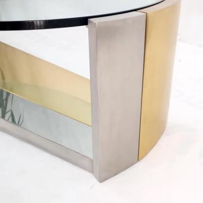 MODERNIST BRASS AND CHROME OVAL COFFEE TABLE IN THE MANNER OF MARIA PERGAY