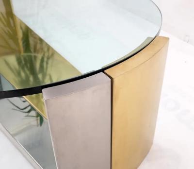 MODERNIST BRASS AND CHROME OVAL COFFEE TABLE IN THE MANNER OF MARIA PERGAY