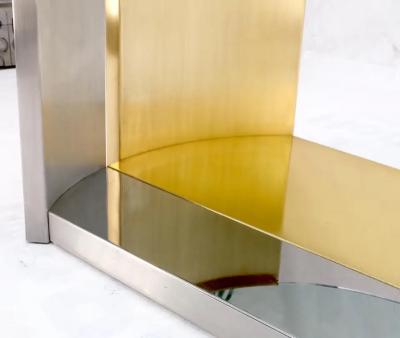 MODERNIST BRASS AND CHROME OVAL COFFEE TABLE IN THE MANNER OF MARIA PERGAY