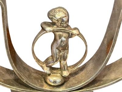 MODERNIST PAIR OF ART DECO SILVERED CANDELABRA WITH STYLIZED CHERUB IN RING
