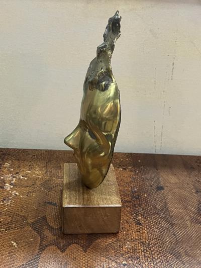 MODERNIST SUITE OF THREE BRUTALIST BRONZE MASK SCULPTURES