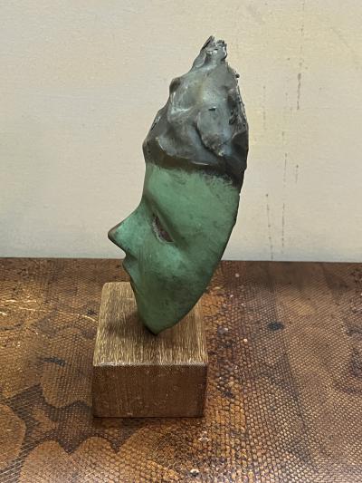 MODERNIST SUITE OF THREE BRUTALIST BRONZE MASK SCULPTURES