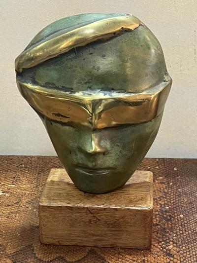 MODERNIST SUITE OF THREE BRUTALIST BRONZE MASK SCULPTURES