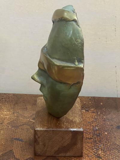 MODERNIST SUITE OF THREE BRUTALIST BRONZE MASK SCULPTURES