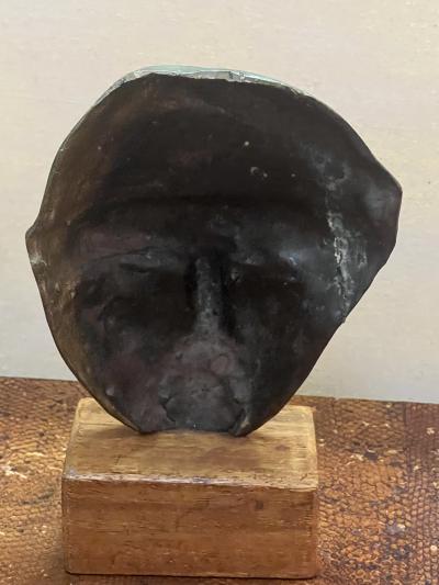 MODERNIST SUITE OF THREE BRUTALIST BRONZE MASK SCULPTURES