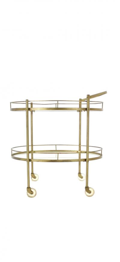 MODERNIST TWO TIER OVAL BRASS GLASS BAR CART
