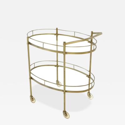 MODERNIST TWO TIER OVAL BRASS GLASS BAR CART